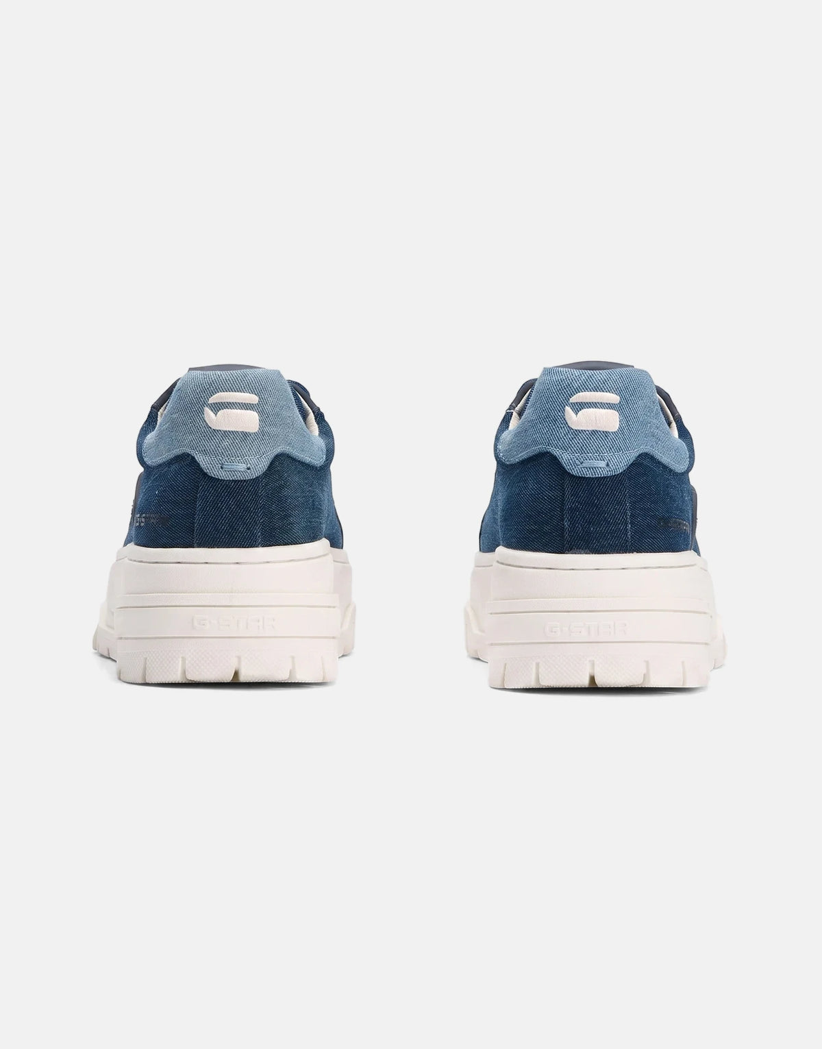 Rear view of two G-Star RAW Lhana VII Dark Navy Sneakers made of denim with white platform soles.