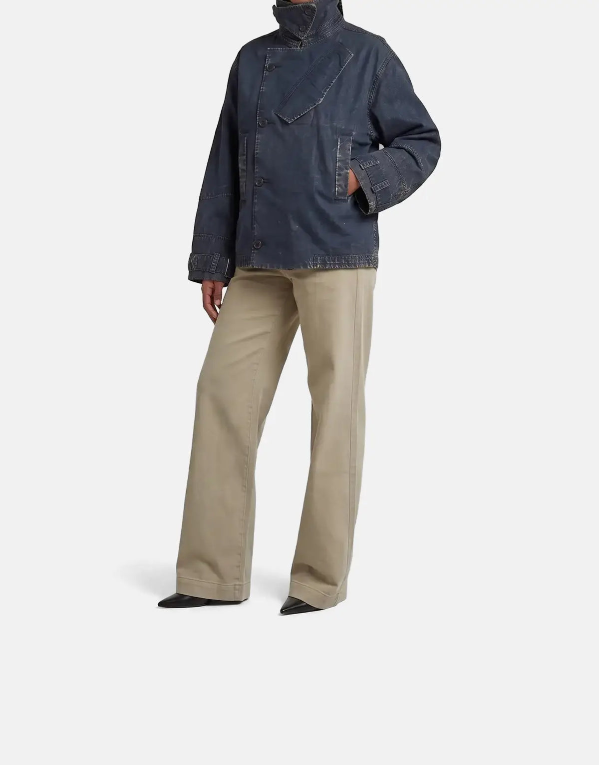 Full length studio shot of a model wearing a dark blue G-Star RAW Oversized Short Trench Coat Overdye Salute with beige