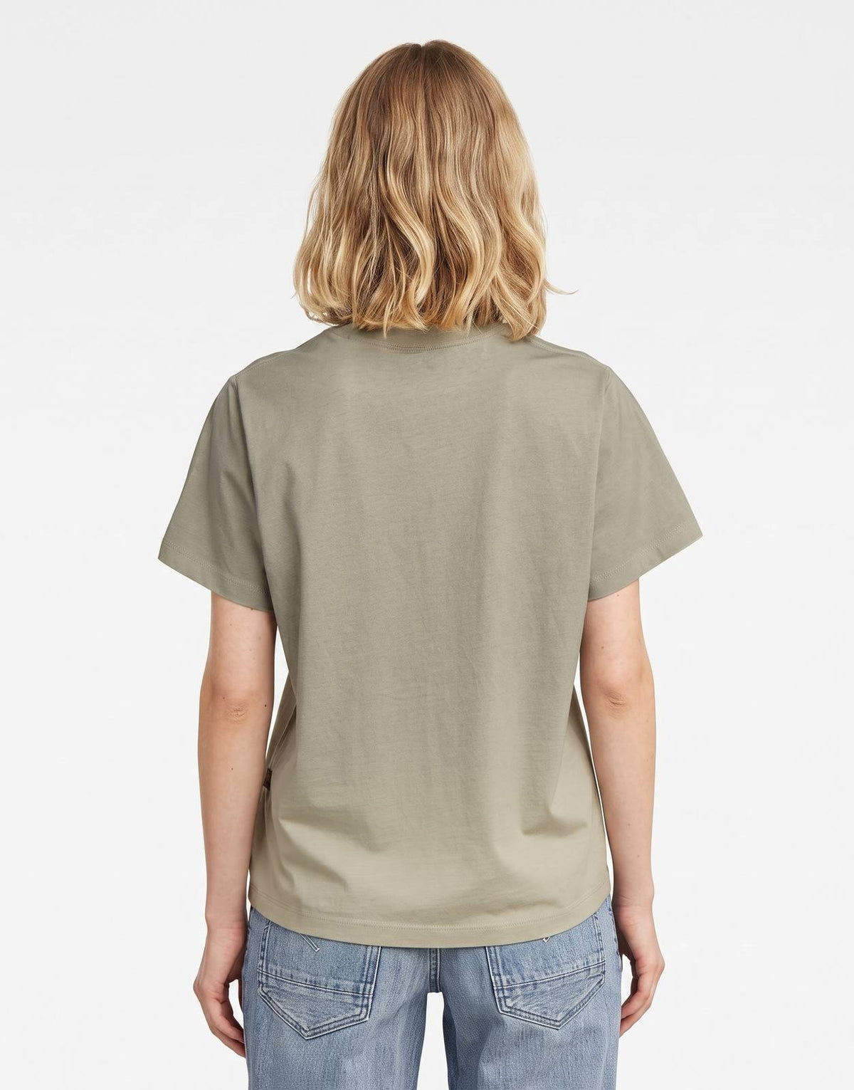 Back view of a woman wearing a light olive green G-Star RAW Sprayed Hyper Graphic short-sleeve t-shirt