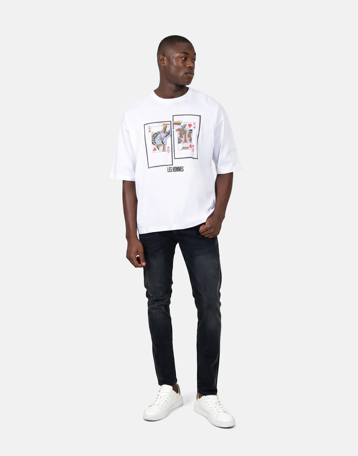 Les Hommes white t-shirt with Queen and King playing card graphic, shown on a male model wearing black jeans and white