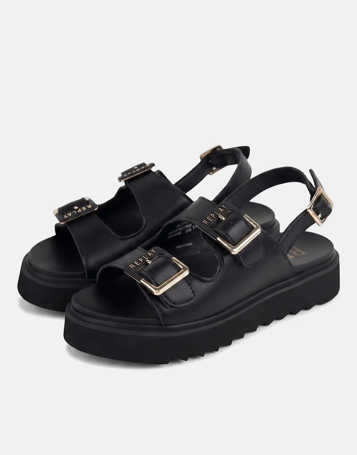 A pair of black Replay platform sandals with chunky soles and gold buckle details, presented in a front-facing studio shot.