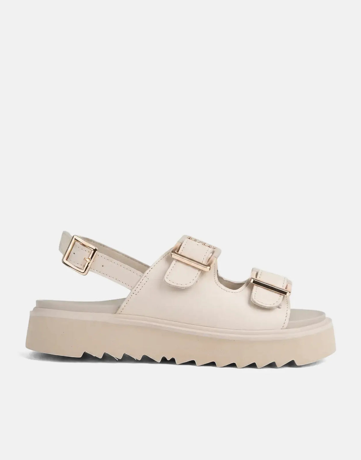 Beige Replay New Alicante platform sandals with gold buckles and a thick serrated sole, shown from a side view.