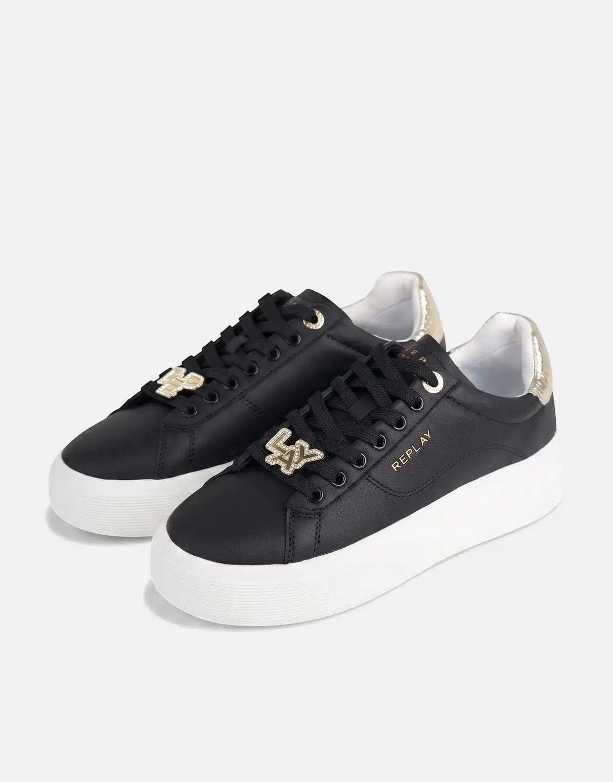 Pair of Replay Notting W Image black sneakers with white platform soles, gold accents, and logo charms.