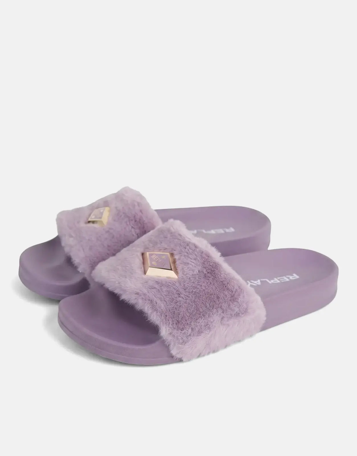 Pair of Replay Up W Along Lilac Slides featuring fluffy purple straps and gold pyramid studs, seen from a slight angle.