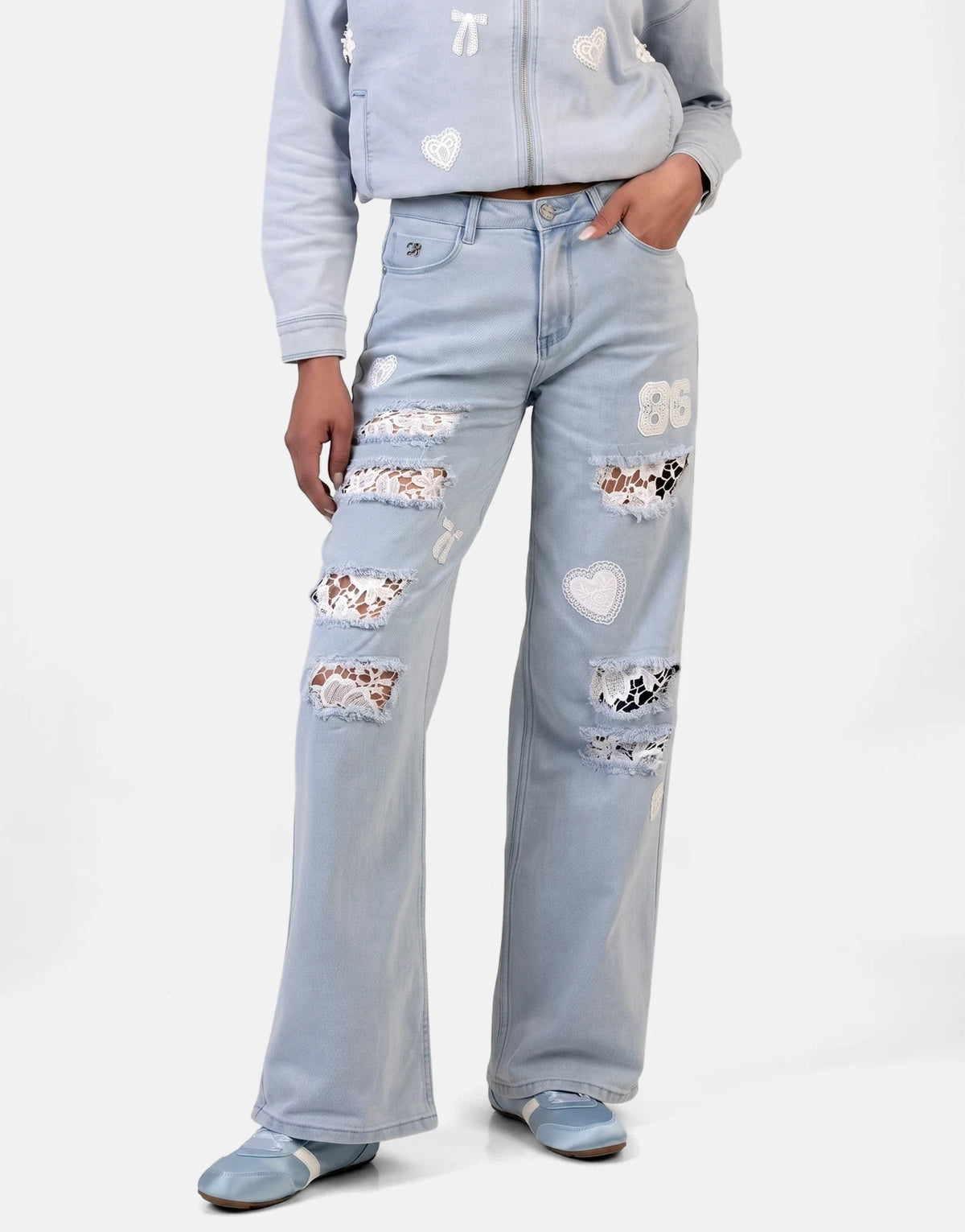 Sissy Boy Kiera wide leg light vintage jeans with white lace patches and matching denim jacket and shoes.
