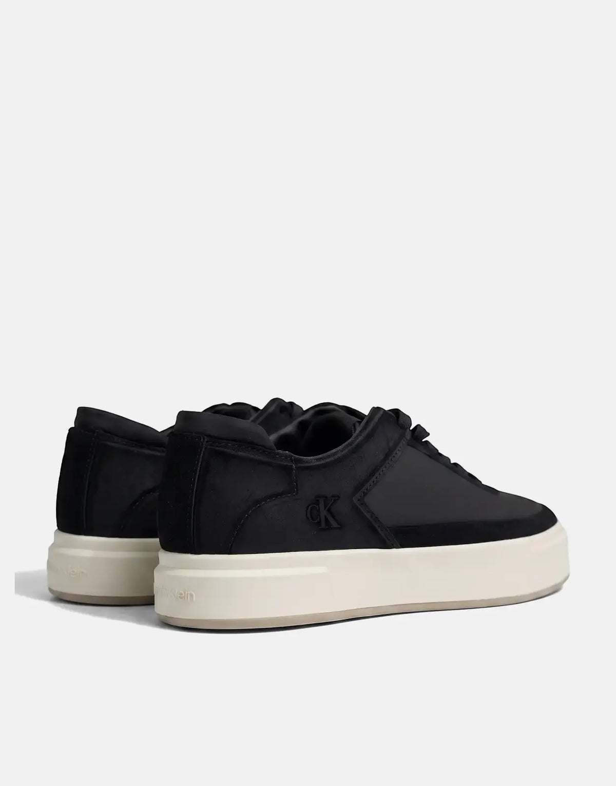 Calvin Klein Basket Cupsole black multi lace-up sneakers, side-back view, with a thick cream platform sole.