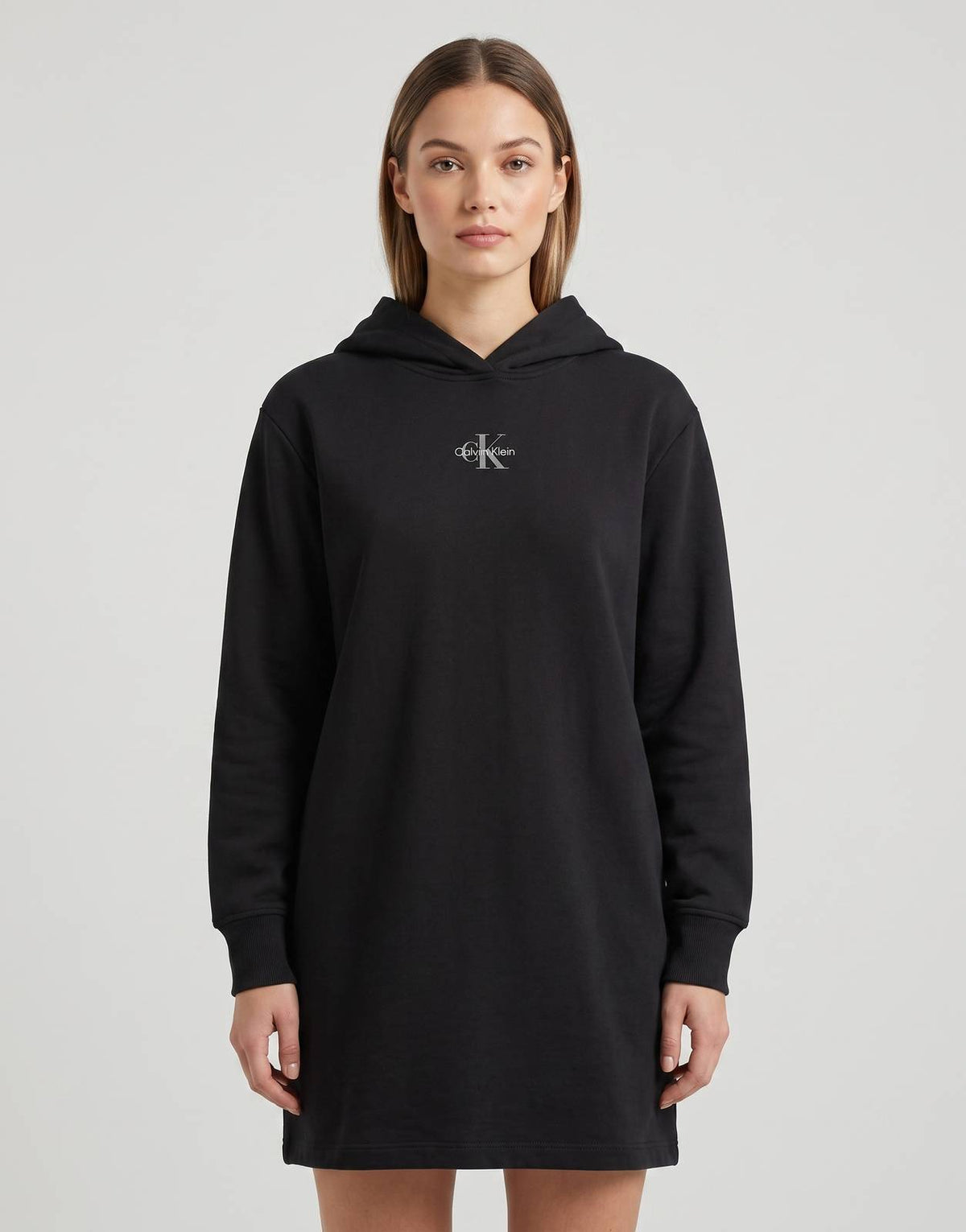 Calvin Klein black hoodie dress with small logo at chest, long sleeves, knee-length.