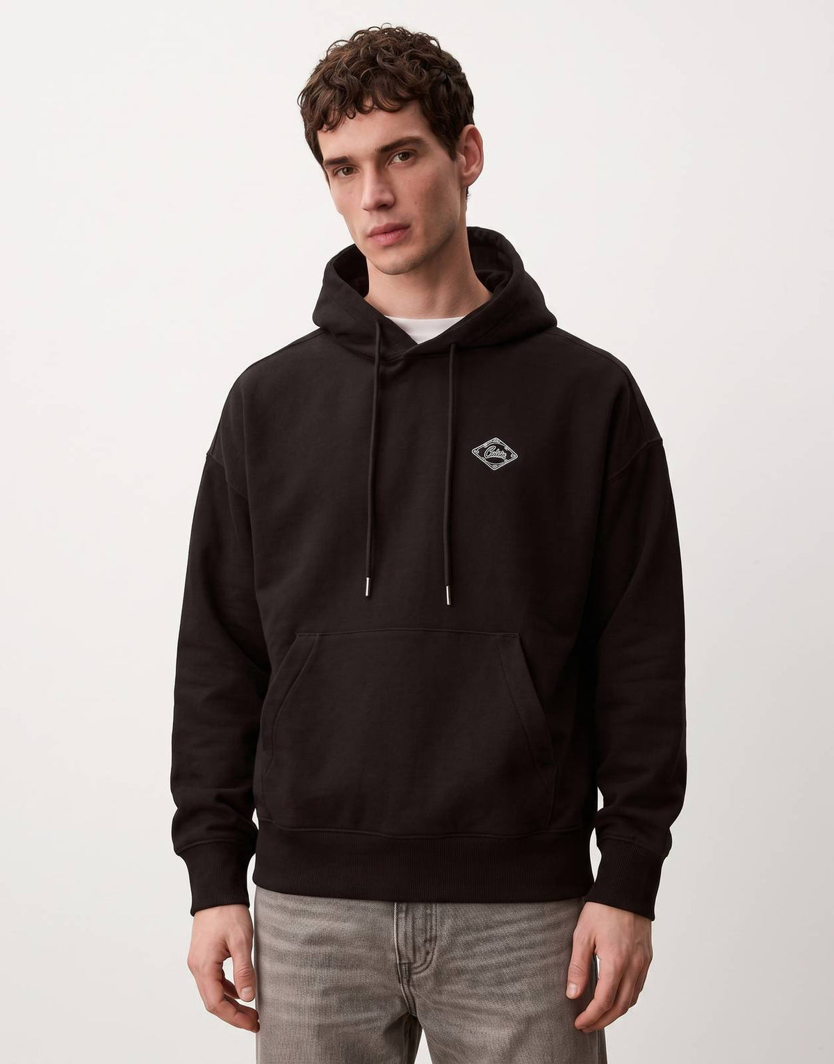 Calvin Klein Premium Fleece Matchbox Black Hoodie for men, featuring a relaxed fit, drawstring hood, and front kangaroo