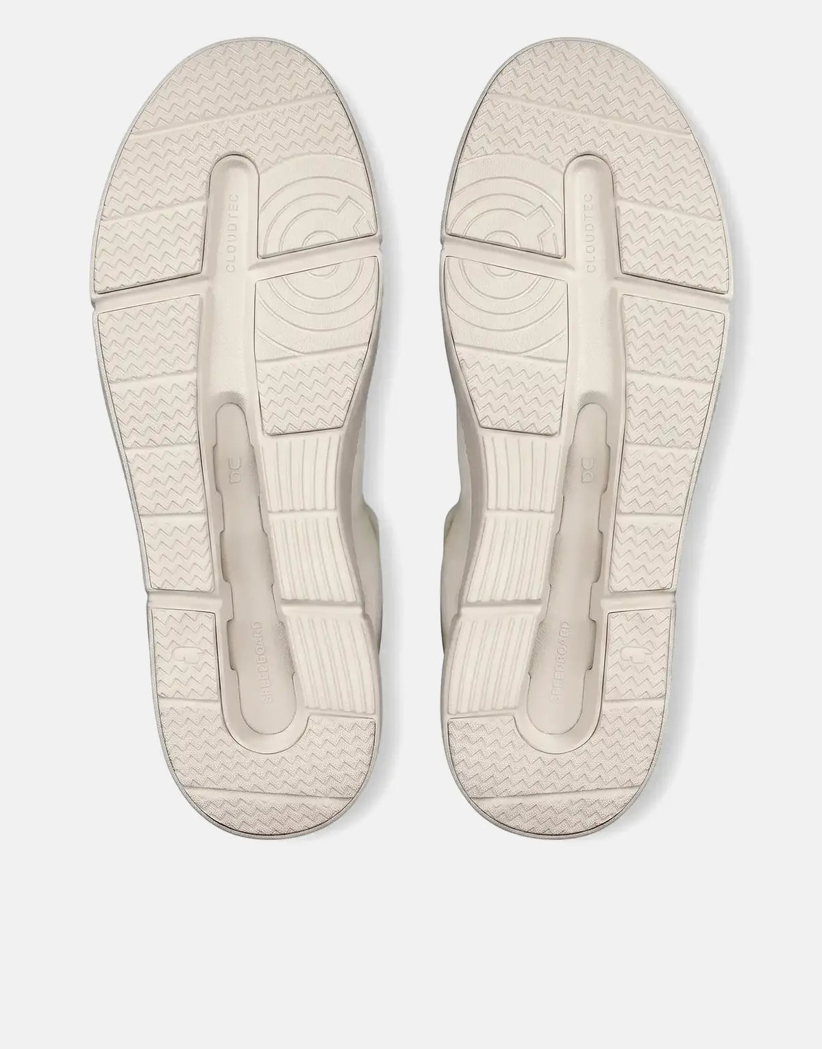 A pair of On Women's Roger Advantage white sneakers, viewed from below, showcasing the textured outsole and CloudTec