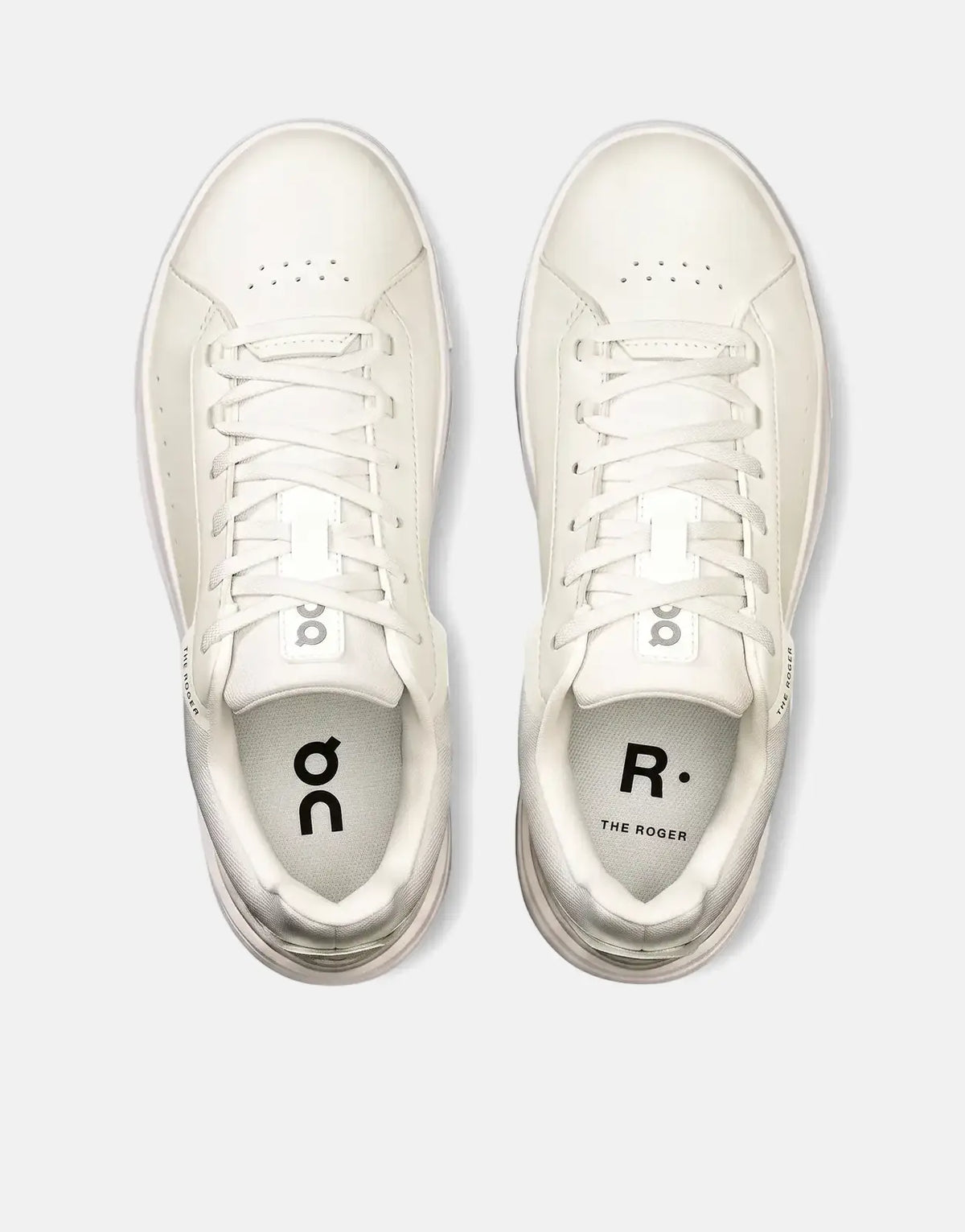Overhead view of a pair of On Women's Roger Advantage white leather sneakers with matching laces and minimal branding.
