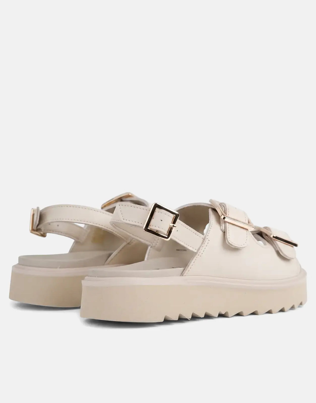 Replay New Alicante tonal beige platform sandals with gold buckles and ridged soles, viewed from the back.