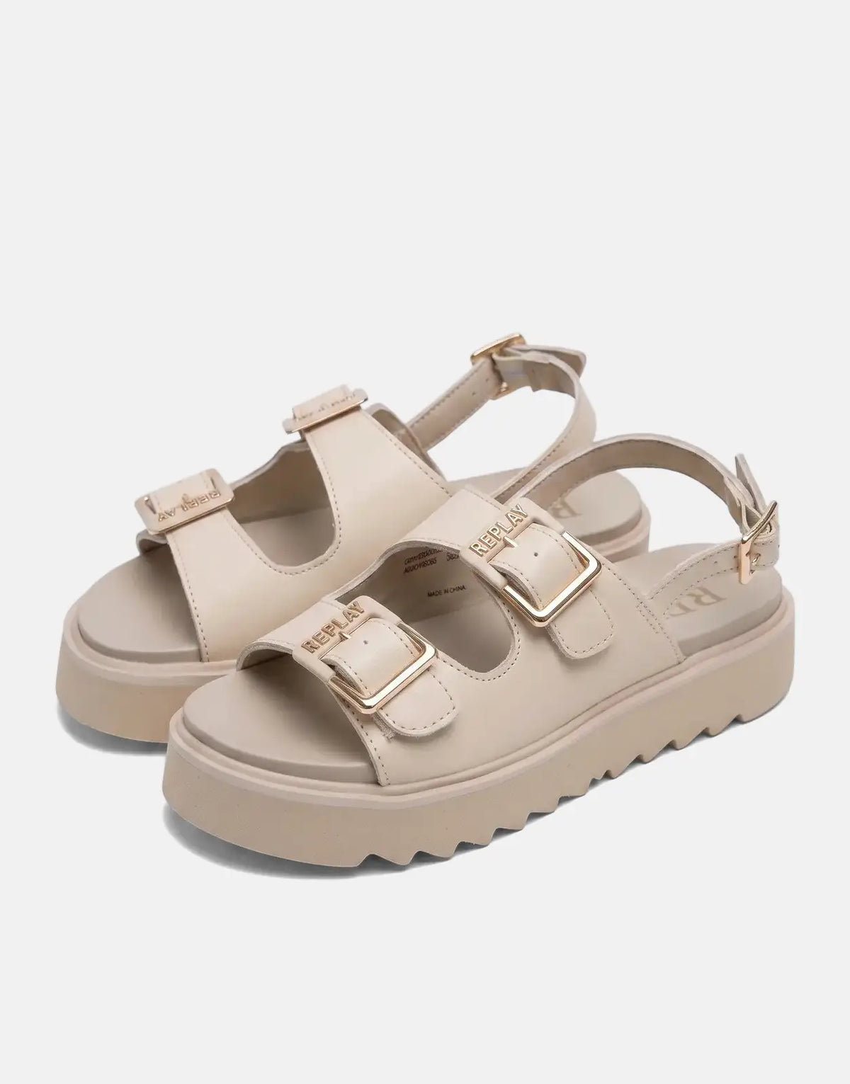 A pair of Replay New Alicante tonal beige platform sandals with gold-tone buckles, displayed on a clean white surface.